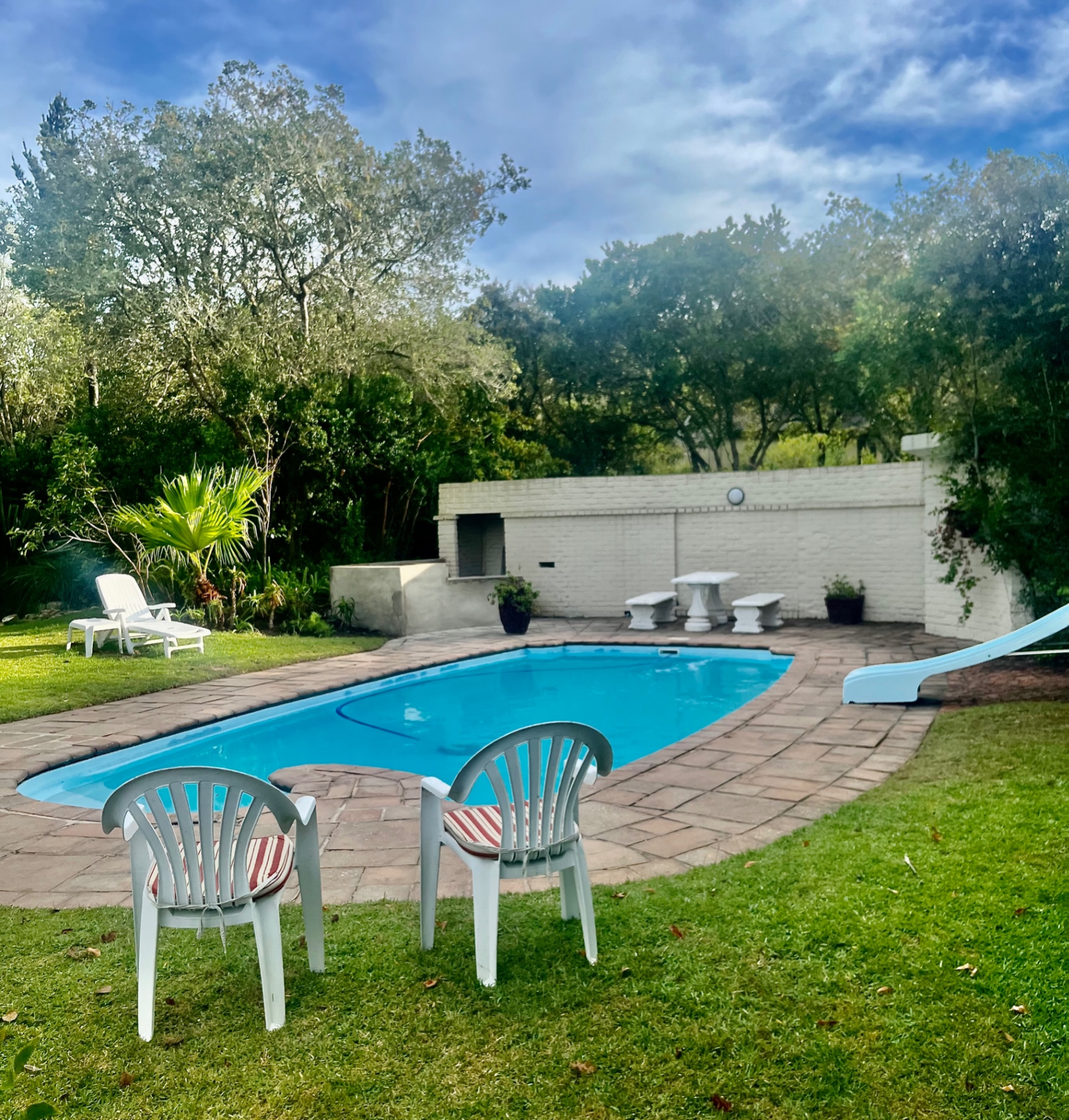 Estate swimming pool with sun loungers at Kairos on the Lake